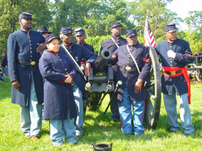 Members of the 12 USC Heavy Artillery fire a replica bronze cannon during re-enactments at Camp Nelson's Civil War Days.