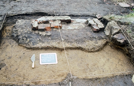 A brick chimney foundation for the house.