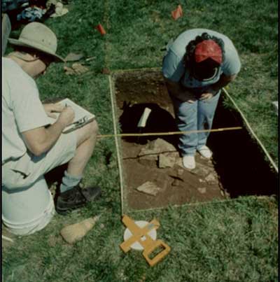 Archaeologists map a portion of a slave house foundation.