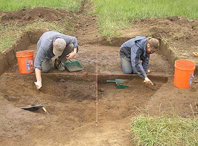Archaeologists excavate a large pit that measured 6 feet in diameter.