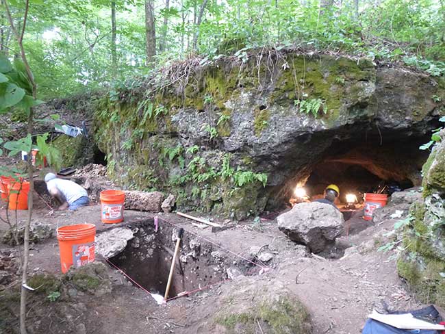Archaeologist excavate units in cave entrance