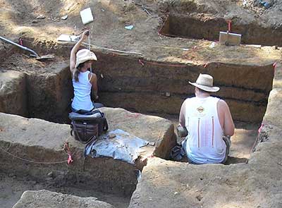 Archaeologists document the stratigraphy at Lot 56.