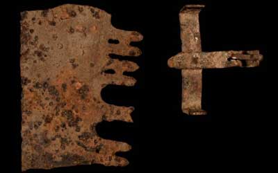 A saw blade (left) and hunting trap (right).