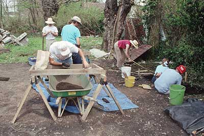 Archaeologists investigating one of the twelve backyards. studied during the project