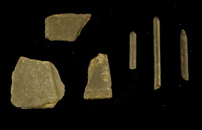 Slate writing board fragments and pencil fragments.