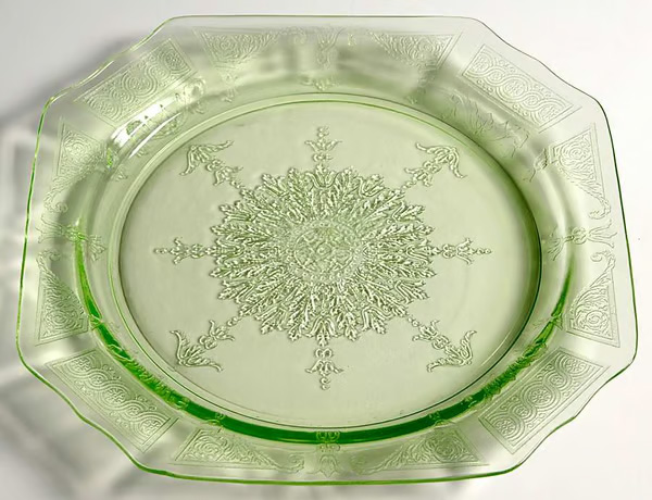A green Depression-era glass plate (Princess pattern). Researchers found pieces of this type of plate at Onionville.