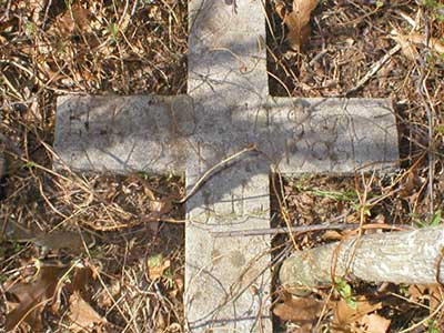 One of several grave markers found near a house foundation.