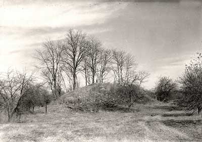 The larger Robbins Mound before excavation (Note person standing on top of the mound).