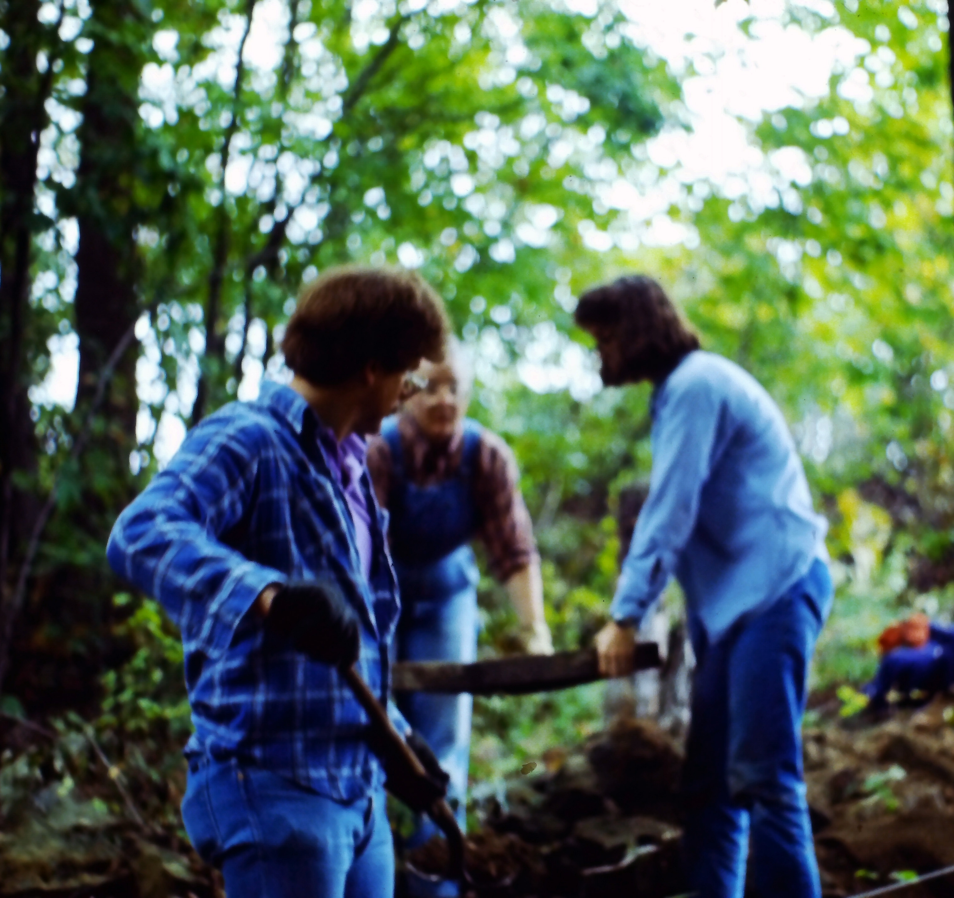 Unit excavation: screening soil to look for artifacts.