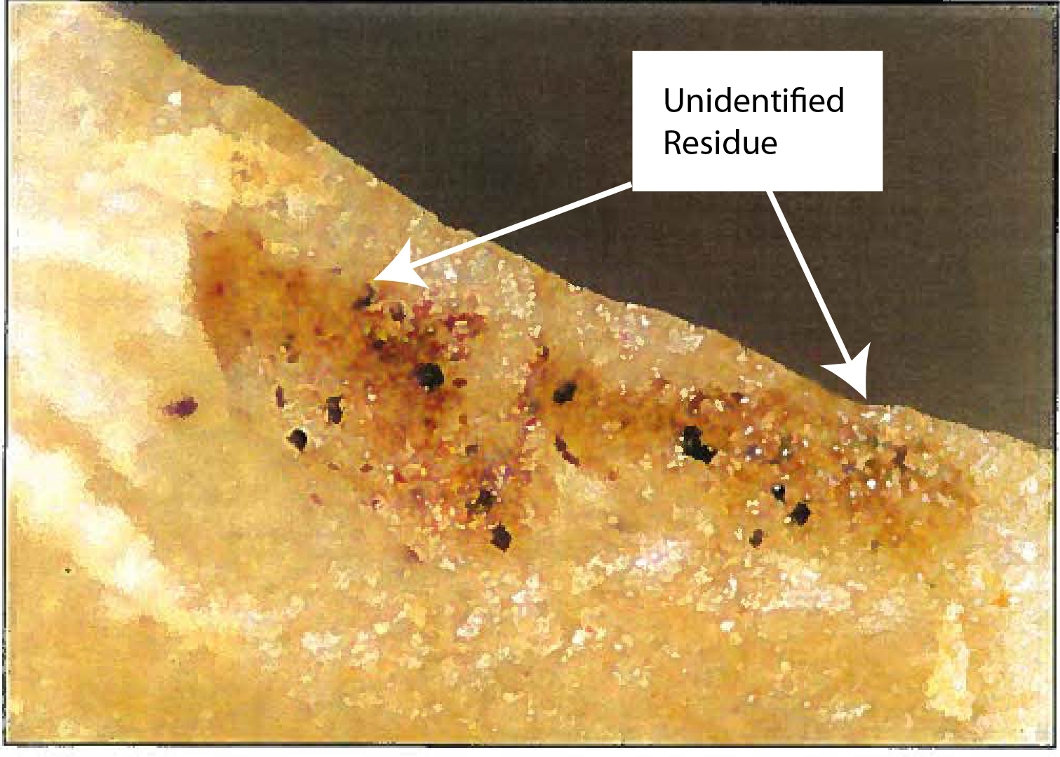 Scraper with unidentified use-wear residue.