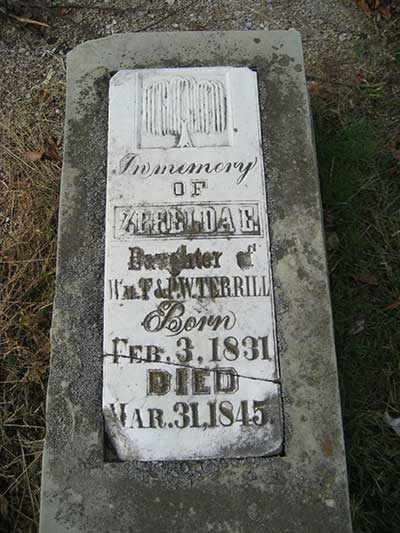 Engraved headstone of Zerelda E. <Br>Terrill. Note the weeping willow motif at the top.