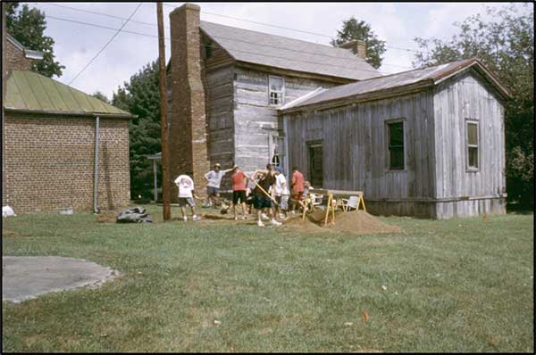 Archaeologists and Students from Bethlehem High School Excavate behind the Howard’s Log House.