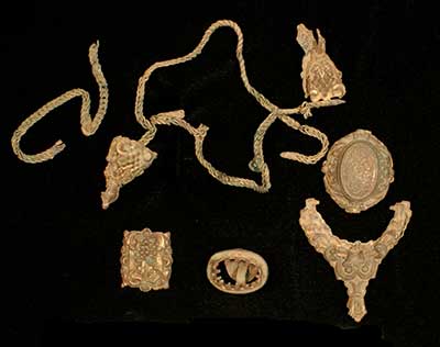 Gold plated jewelry from the pit cellar. 