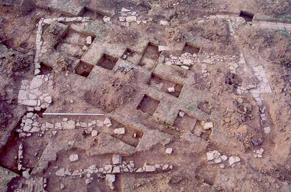Aerial photograph of exposed house foundation.
