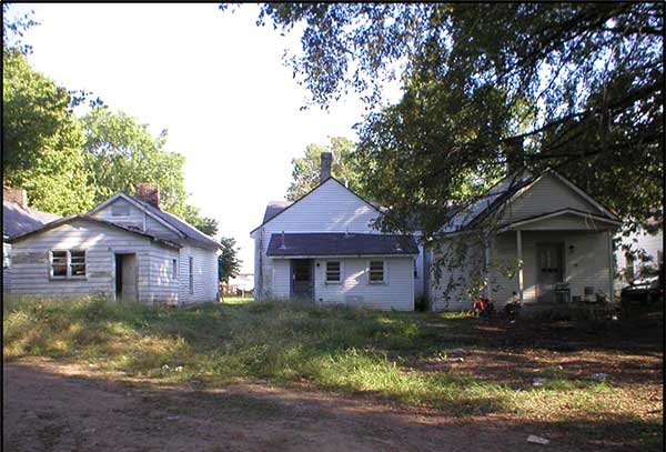 The rear yards of shotgun houses that faced Center Street