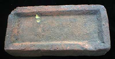A handmade brick with a “frog” from the remains of an early nineteenth-century house.