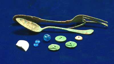 Fork, spoon, and personal items - beads and buttons.