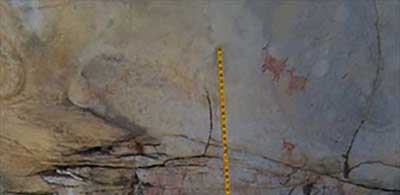 Deer pictograph panel - two upper figures and several lower figures - with a scale to the left.