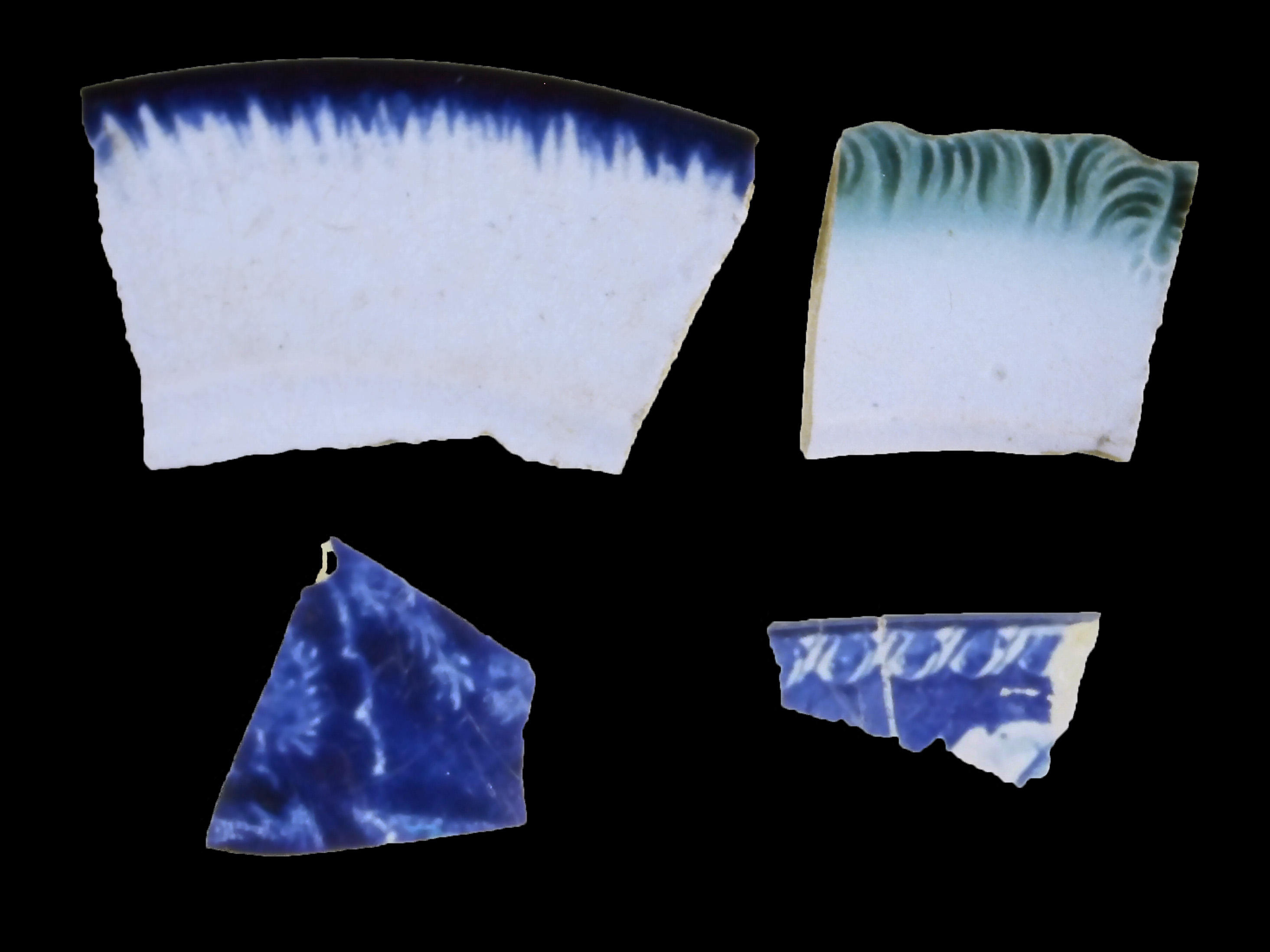 Ceramic dish fragments:  top, blue and green shell-edged whiteware;  bottom, blue pearlware.