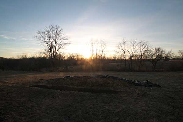 Sun setting over site