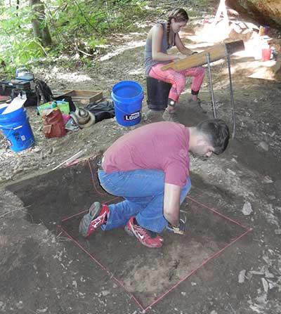 Eastern Kentucky University students excavate a unit.