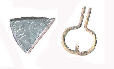 A silver piece of eight (left) and a mouth harp (right) from the site.