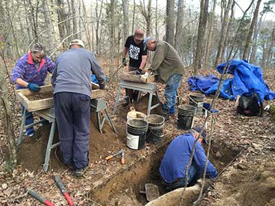 Archaeologists and volunteers working at the soldiers' encampment.