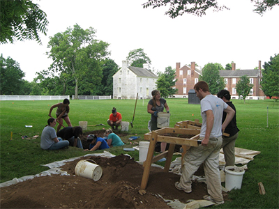 University of Kentucky students learn excavation techniques at the site of the 1810 Meeting House.
