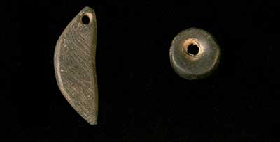 Cannel coal pendant (left) and bead (right).