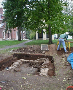 Archaeologists exposed the top of a  privy.