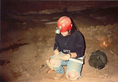 An archaeologist documents a saltpeter vat.