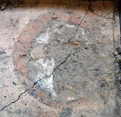 A sun circle (lower right quadrant eroded) painted on a house floor at Wickliffe Mounds.